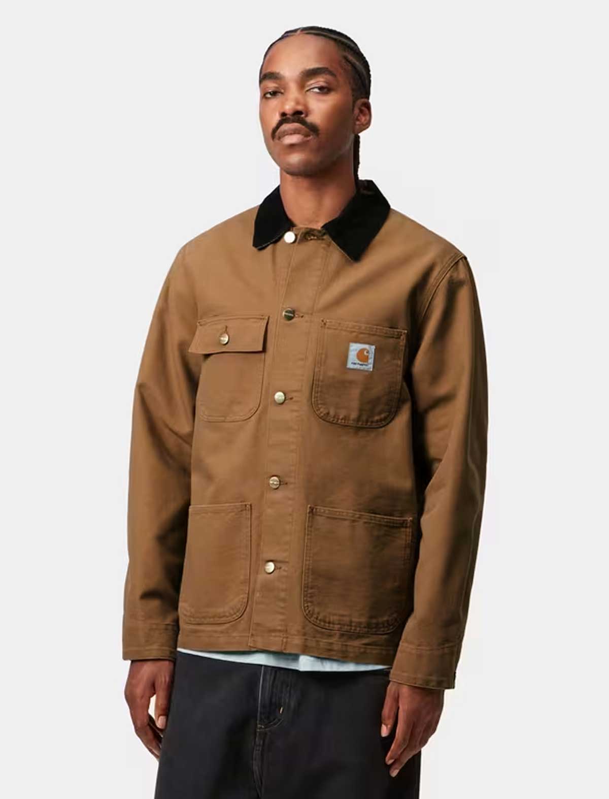 Man wearing a Carhartt brown jacket with a black collar on a white background