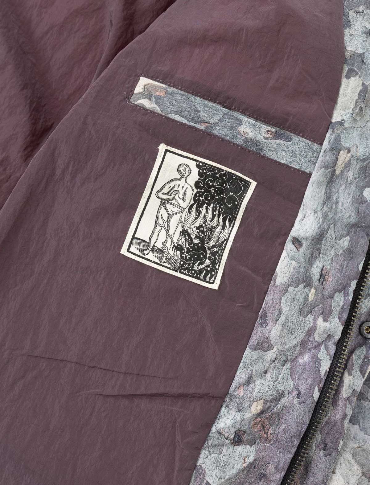 Close-up of a textured fabric with a printed design on a garment.
