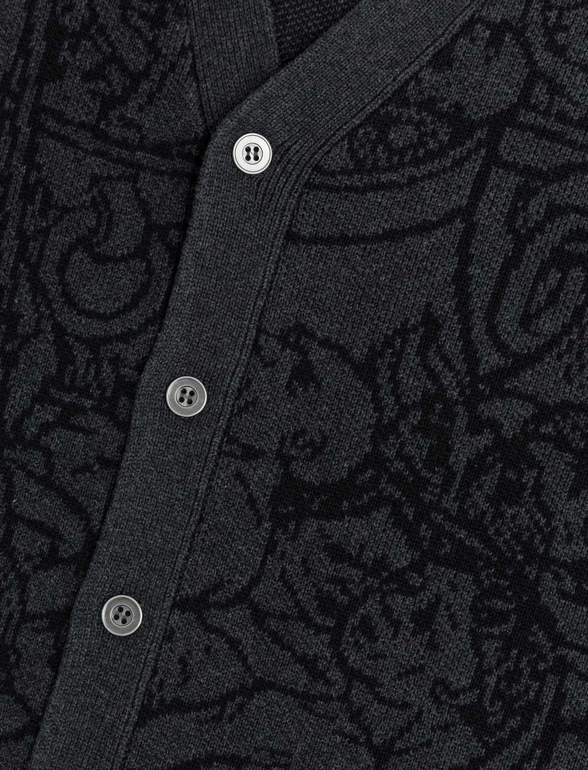 Close-up of a dark patterned fabric with buttons
