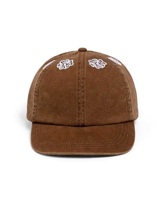Heresy Malva Brown cap with white designs on a white background