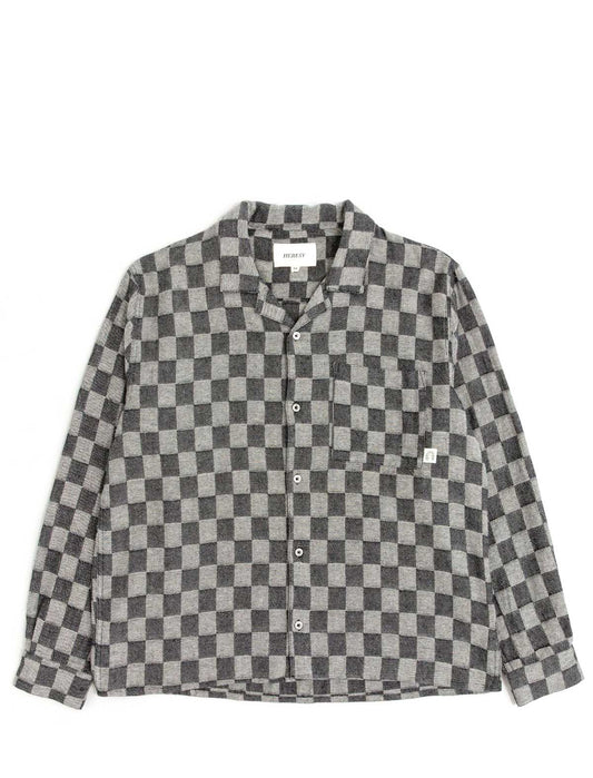 Checkered shirt with a brand label on a white background
