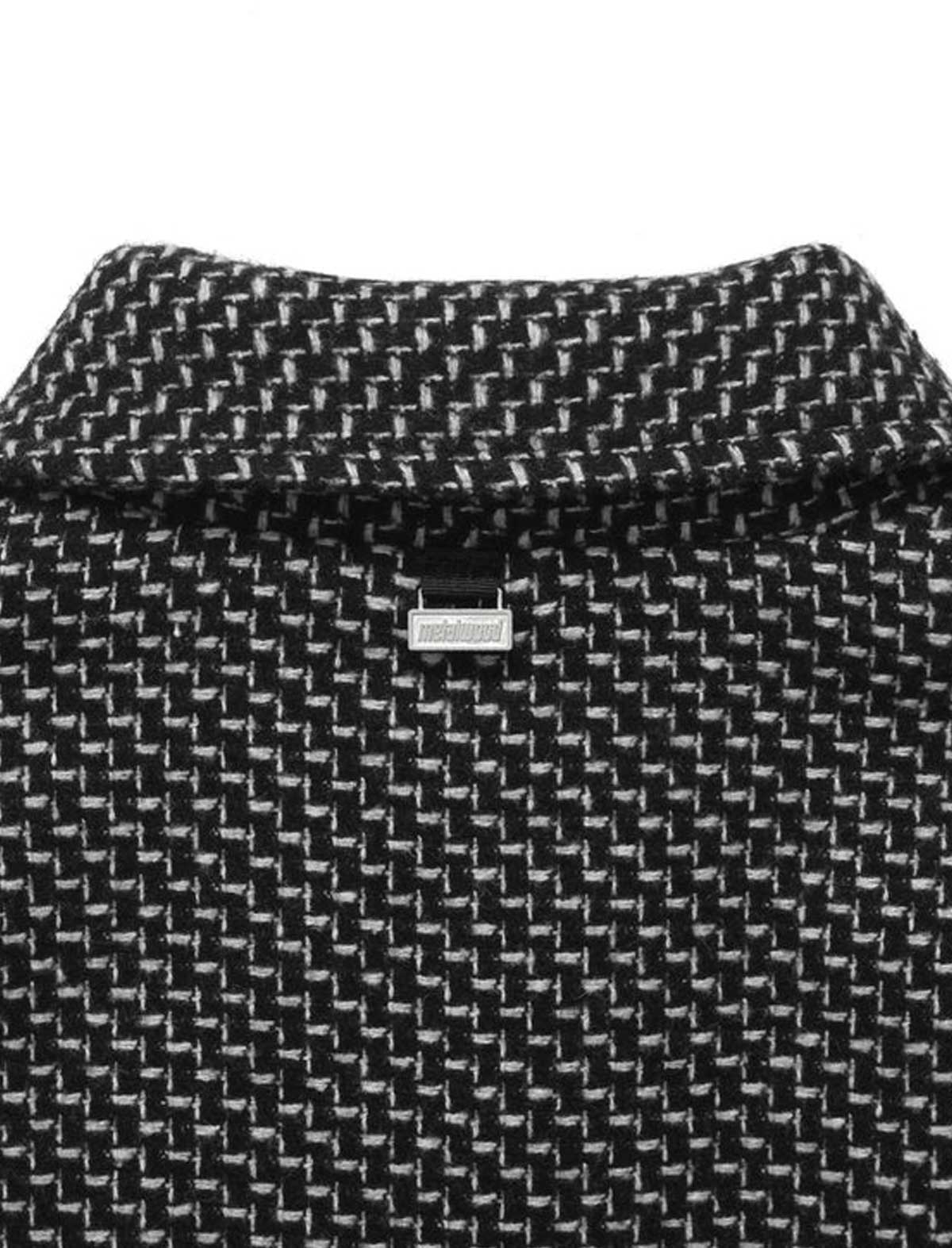 Black and white patterned fabric with a metalwood brand label on a white background
