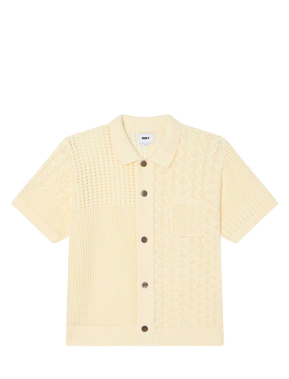 Light yellow textured shirt with buttons on a white background