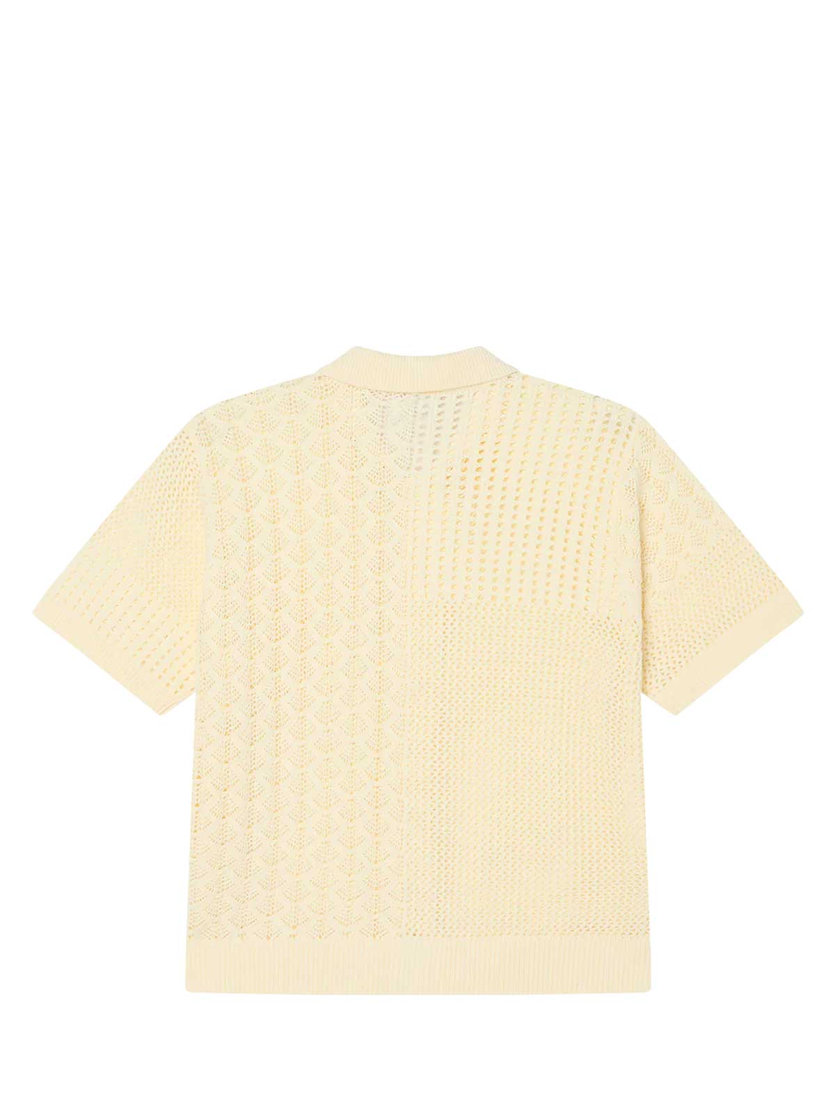 Light yellow textured shirt on a white background