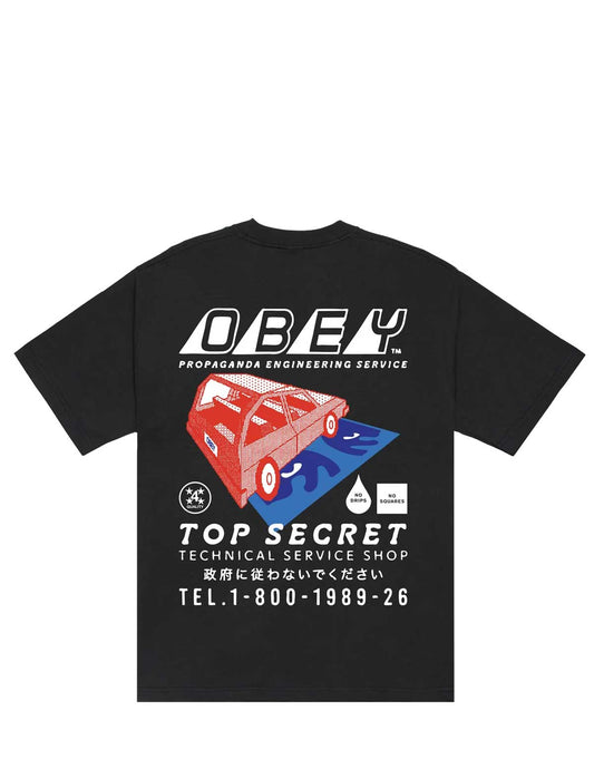 A black short-sleeve t-shirt with a large graphic print on the front. The graphic features the brand name 'OBEY' in bold white letters above a stylized red car on a blue and white background, with additional Japanese text and numbers below.