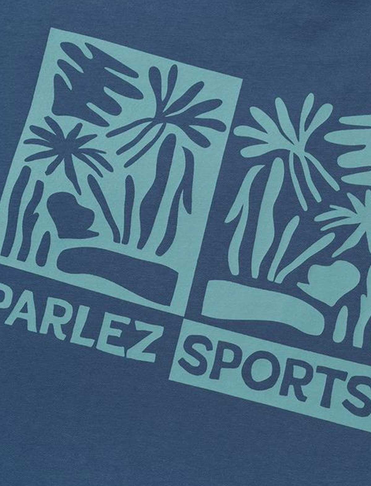 Blue t-shirt with Parlez Sports logo and leaf design