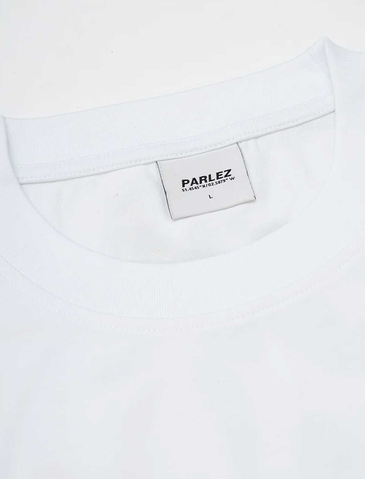 Close-up of a white t-shirt with a Parlez label on a white background